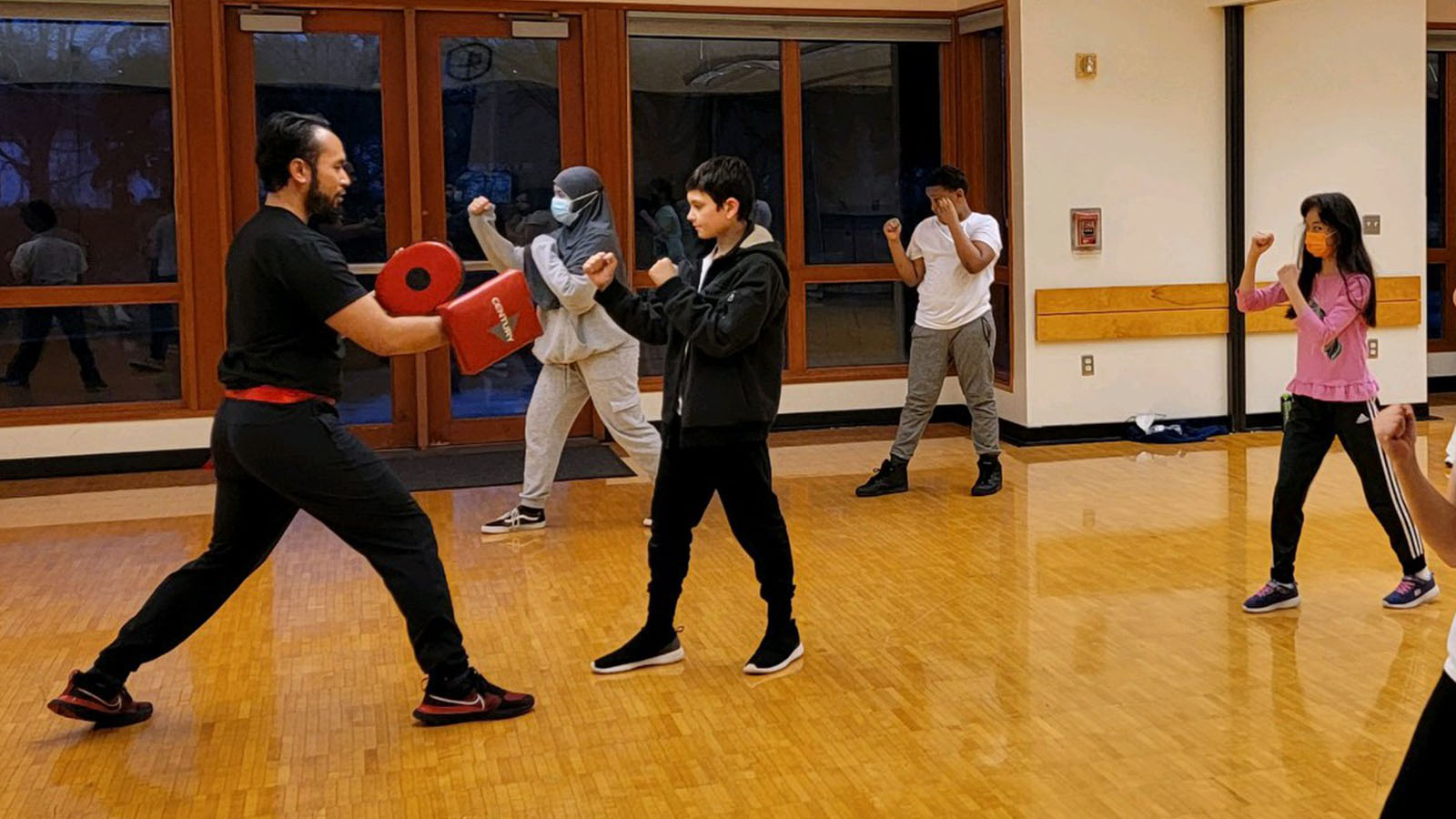 Students practicing partner drills