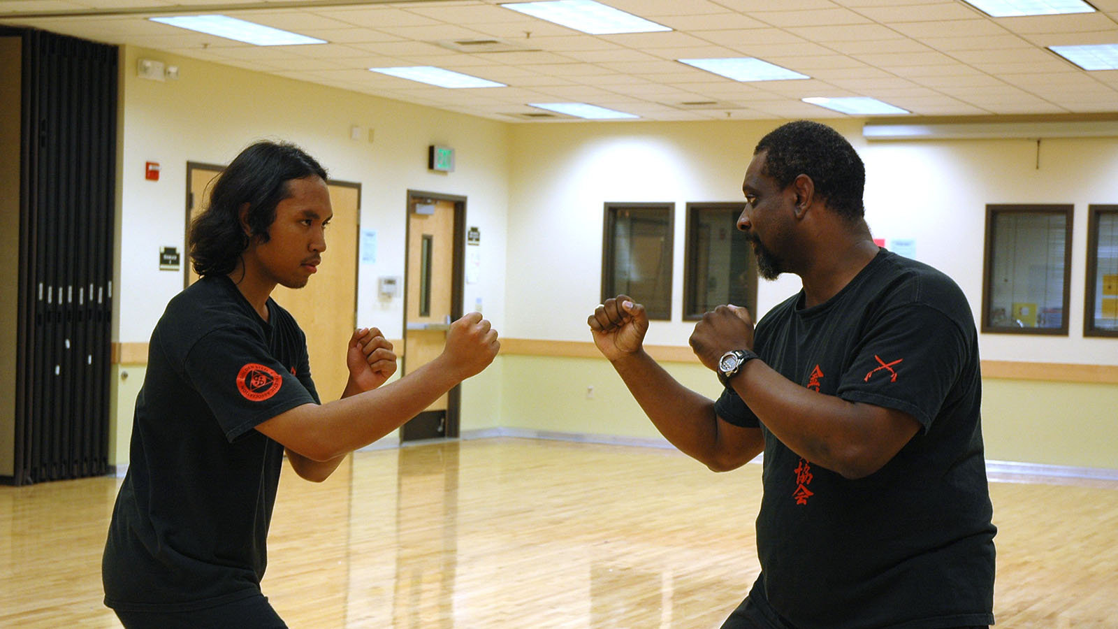 Two students practicing partner drills